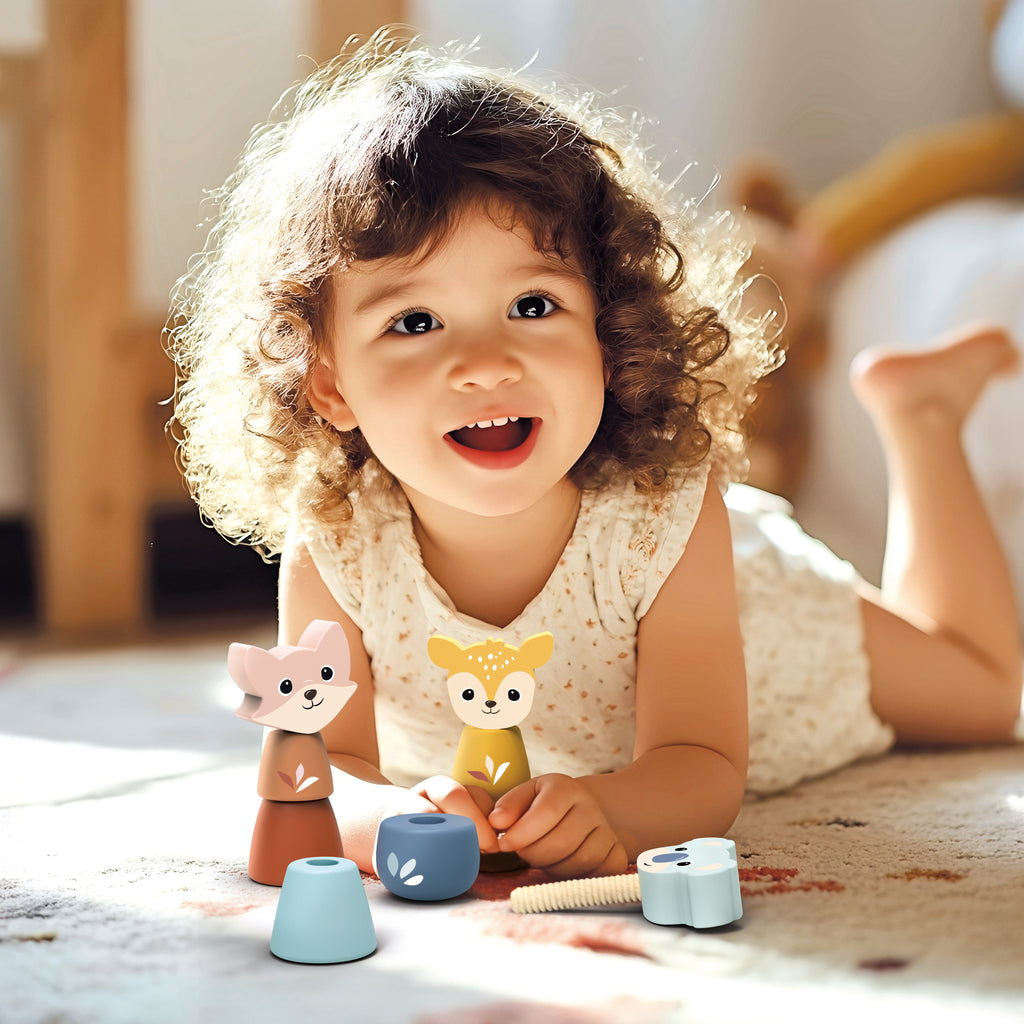Child playing with toys on a carpeted floor