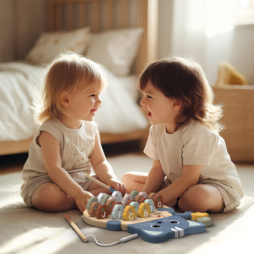 Two young children playing with a toy on the floor in a bedroom.